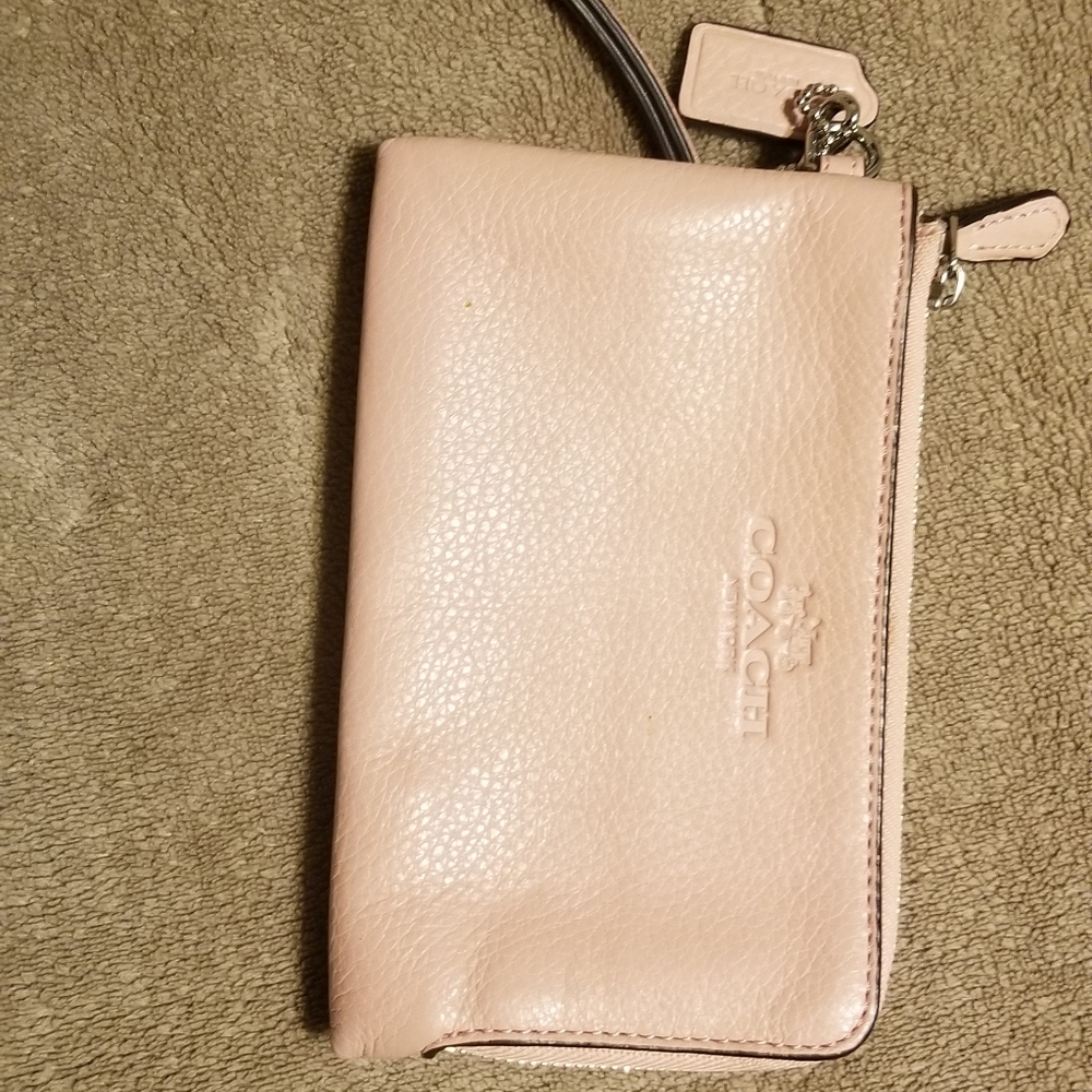 Soft pink Coach wristlet